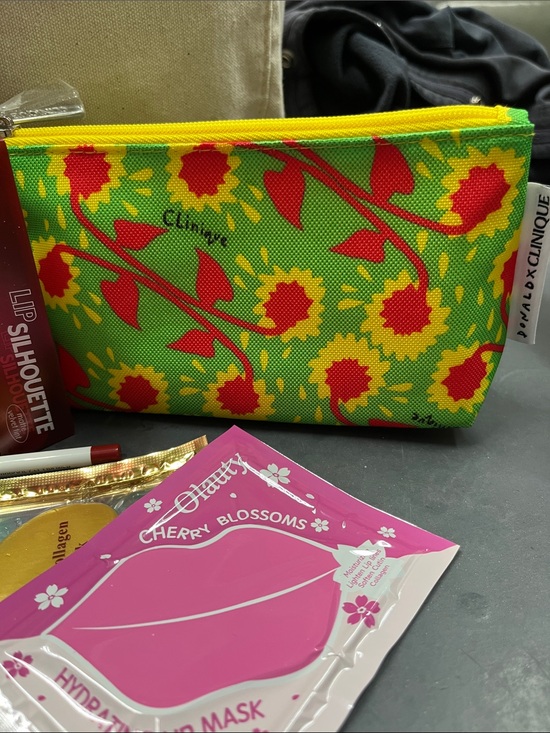 Clinique Handbags - NWOT Clinique Donald Sunflower Cosmetic Pouch -  full of new items nail body lip